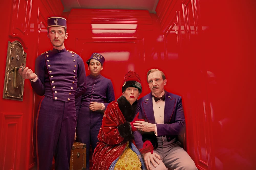 a group of people in a red room
