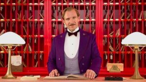 a man in a purple suit