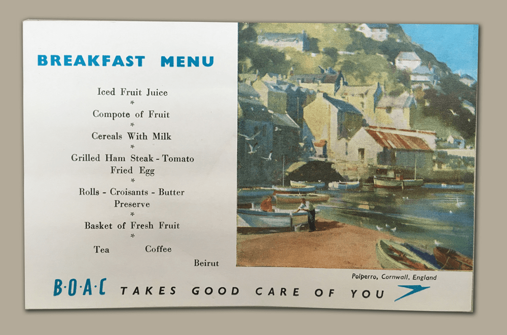 a menu with a picture of a town and boats