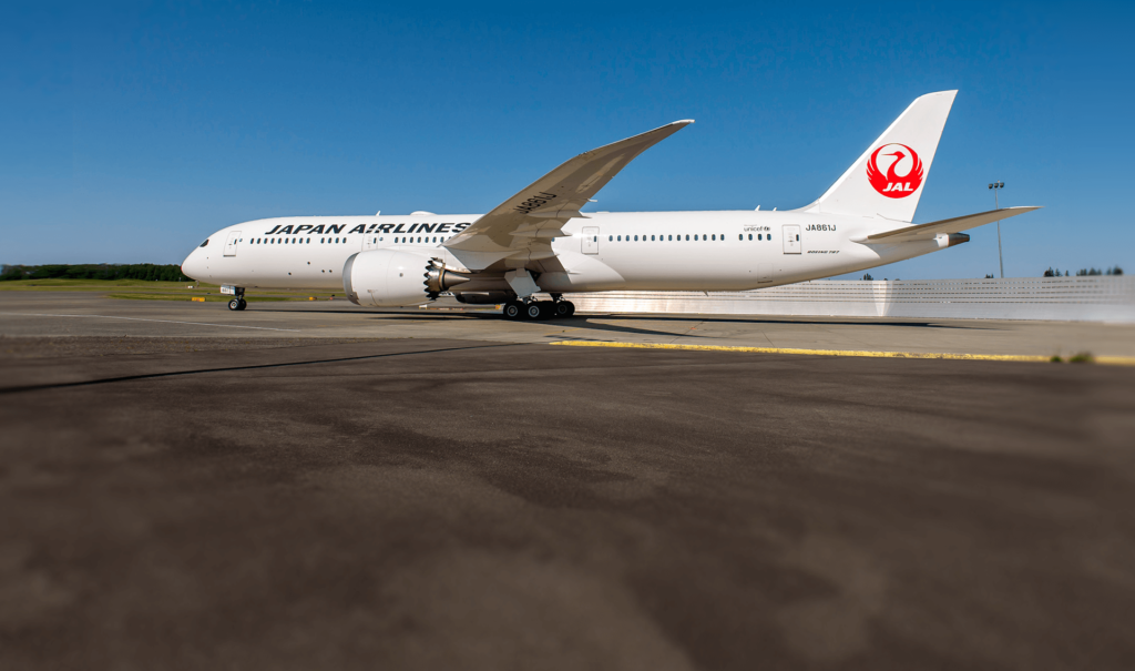 a white airplane on a runway