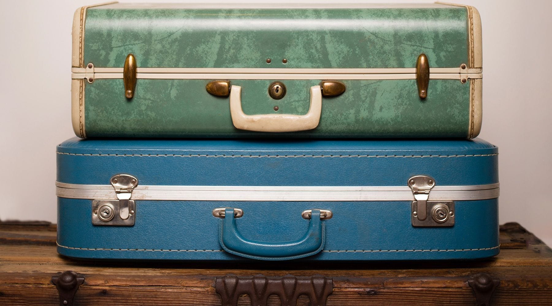 Old vintage suitcase on a airport luggage conveyor belt. Baggage