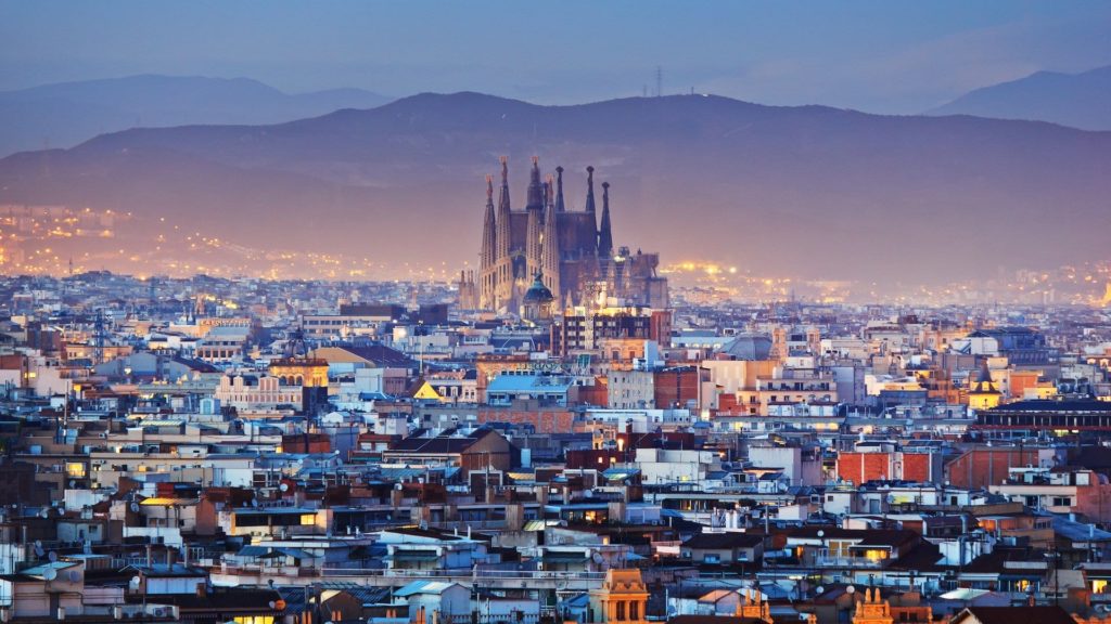 a city with a castle in the background