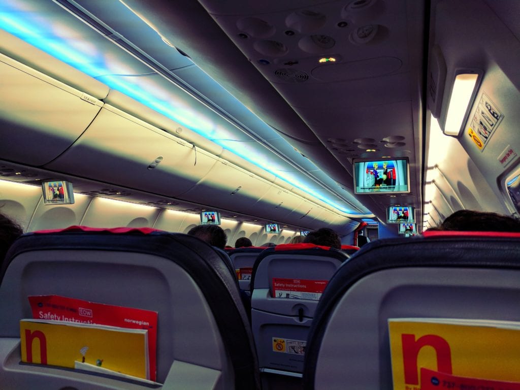 a plane with seats and a television