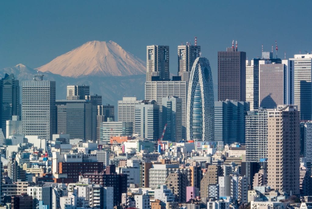 a city with a mountain in the background