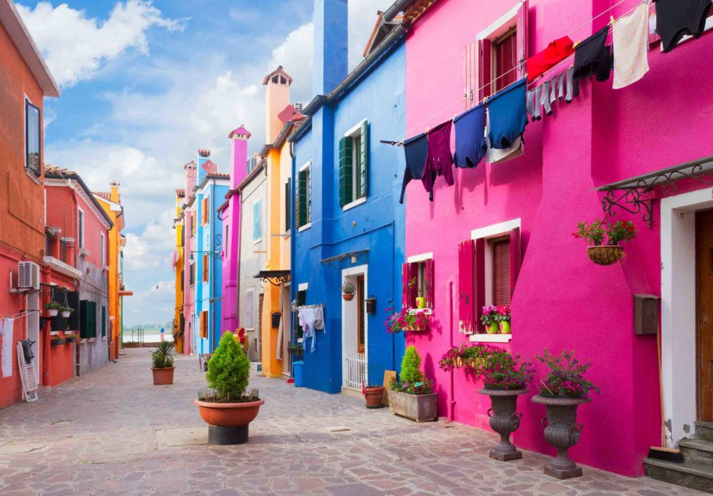 a colorful buildings with clothes out