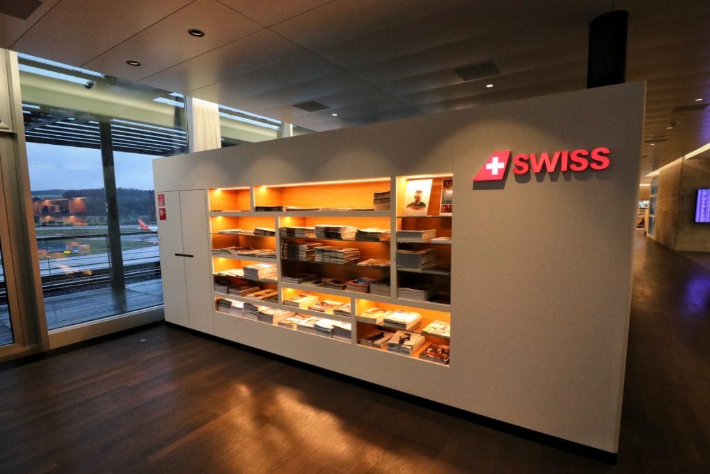 a display case with shelves and a sign