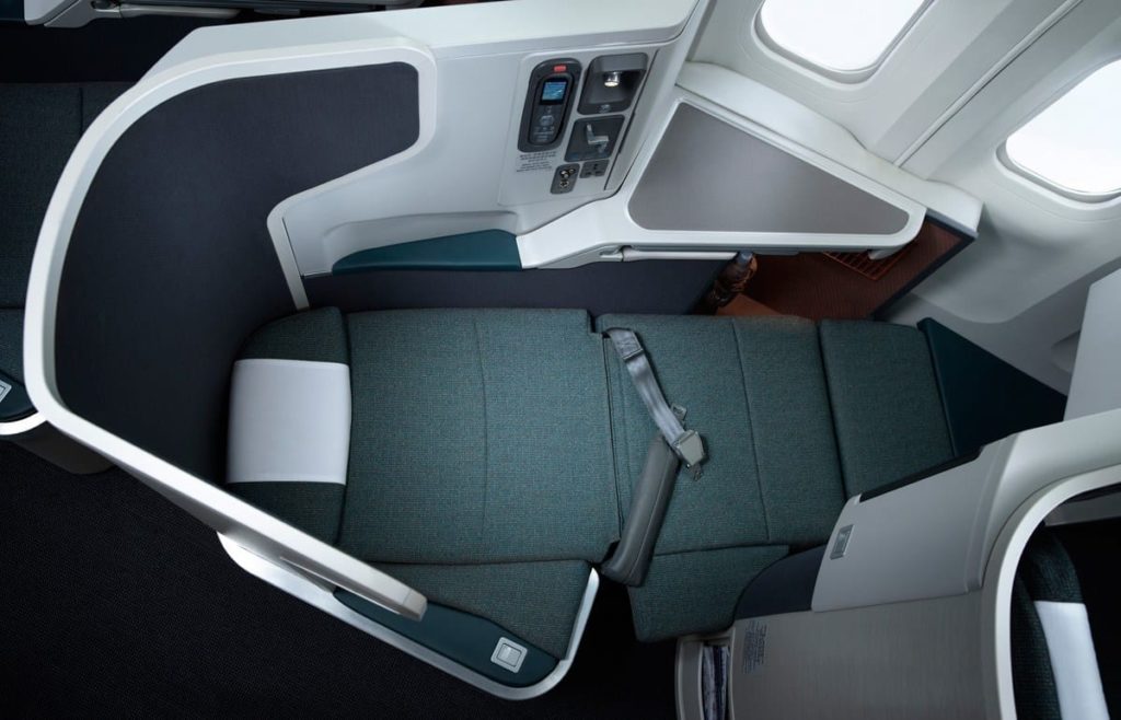 an airplane seat with a seat belt