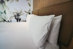 a bed with white pillows