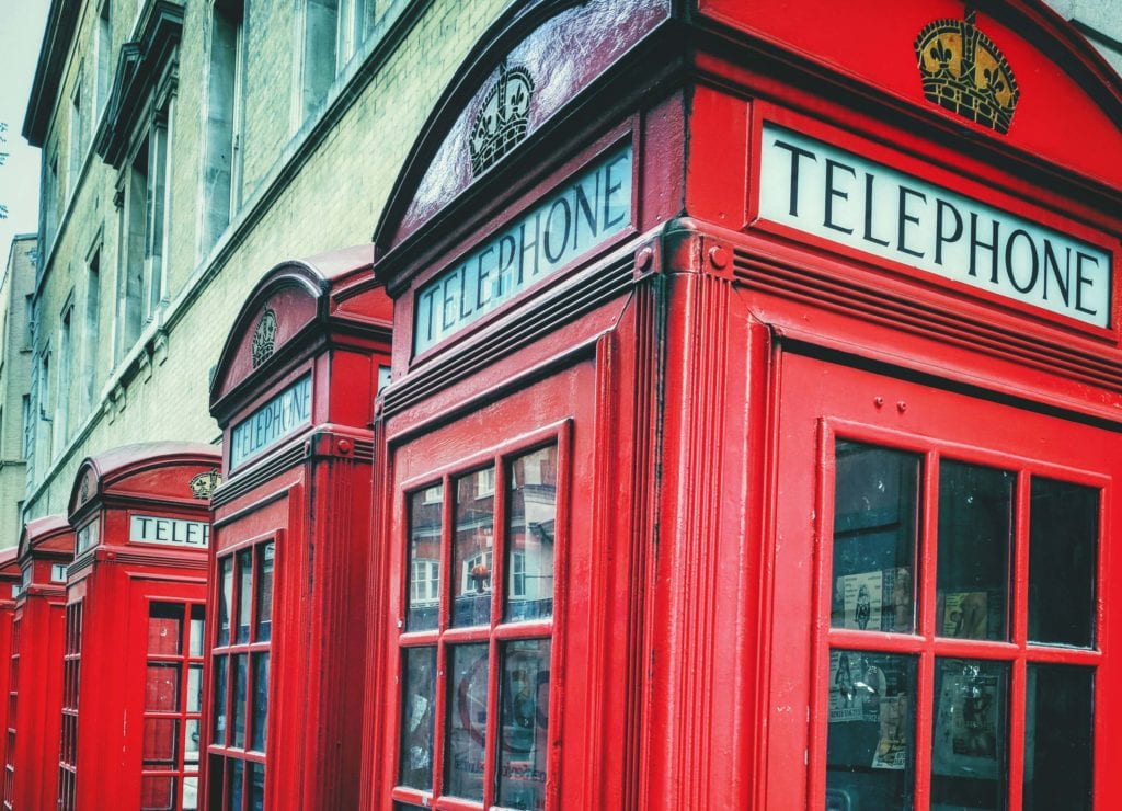 a group of red telephone booths
