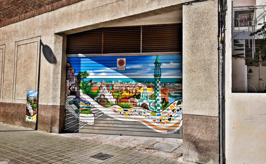 a painted garage door with a picture of a city