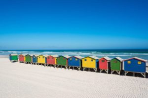 35857495 - colorful bathhouses at muizenberg, cape town, south africa, standing in a row.