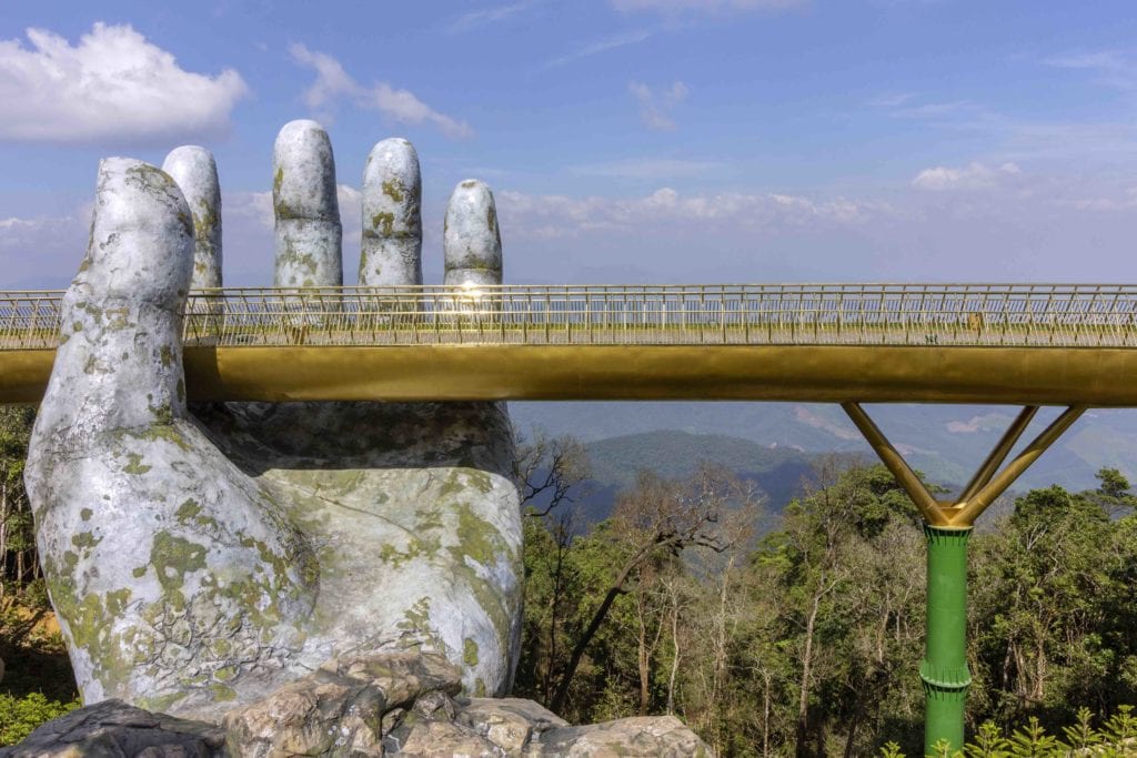 Da Nang, Vietnam - October 31, 2018: Golden Bridge known as “Hands of God”, a pedestrian footpath lifted by two giant hands, open in July 2018 at Ba Na Hills in Da Nang, Vietnam.