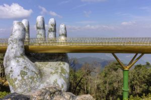 a bridge with a large hand holding a bridge