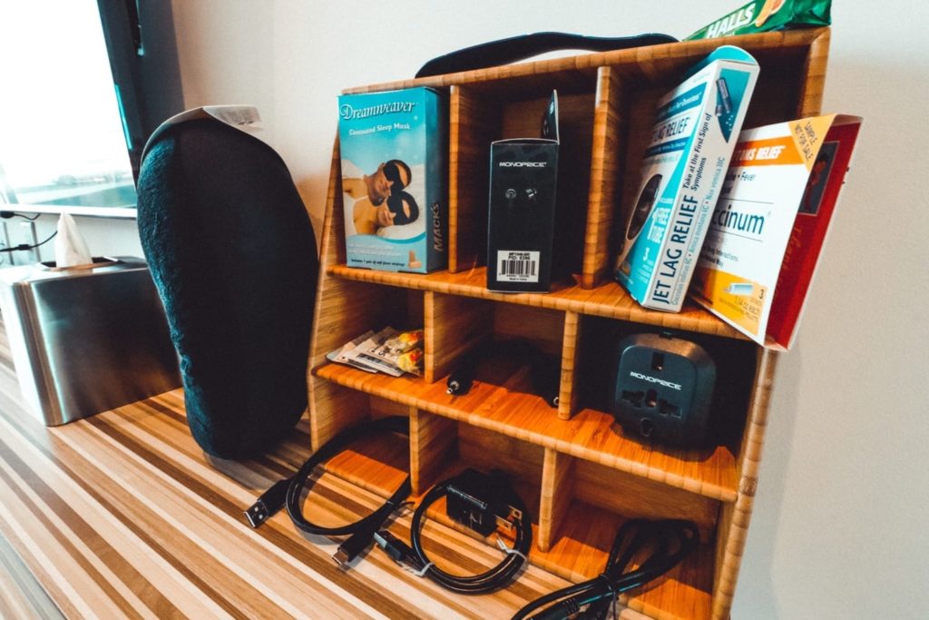 a wooden shelf with items on it