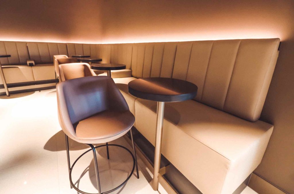 a booth seating with chairs and tables