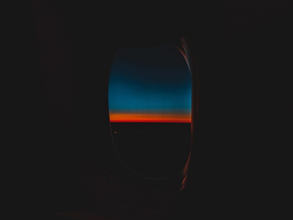 a sunset seen through a window