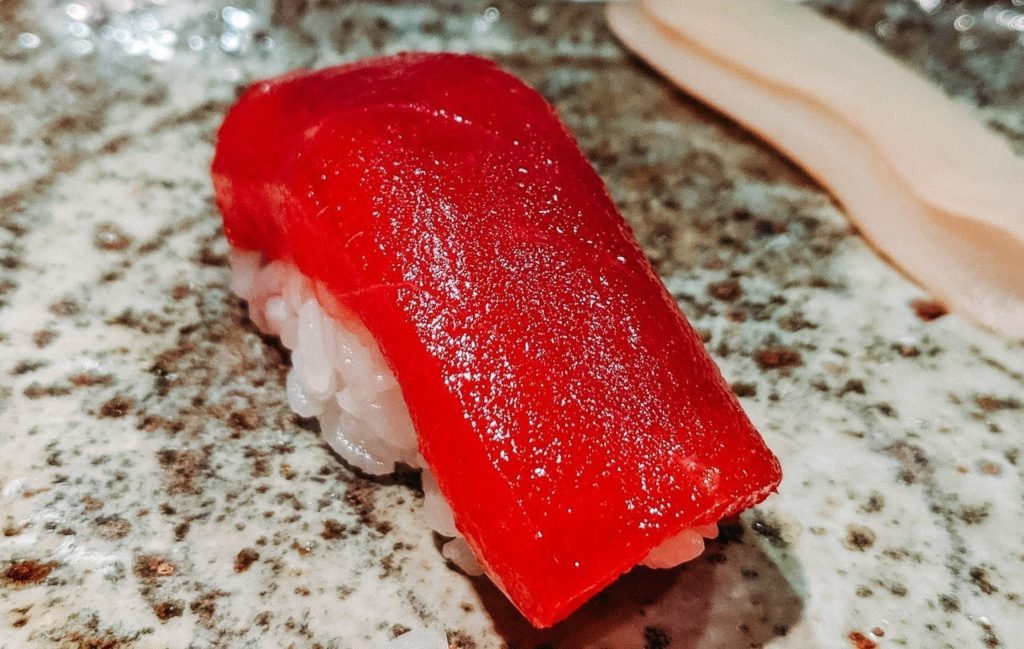 a piece of sushi on a counter