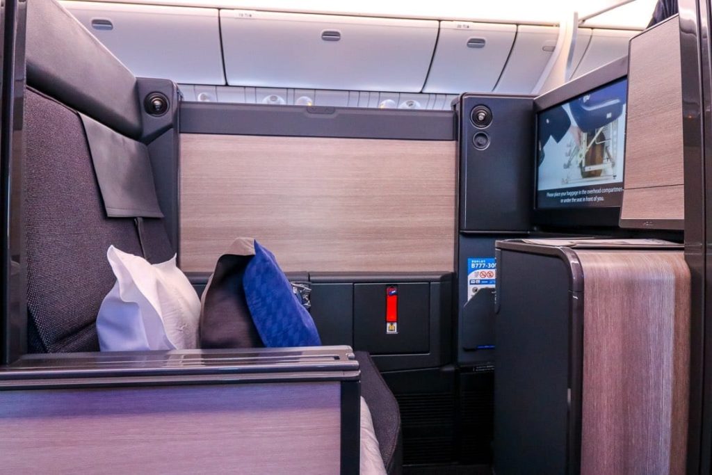 a tv and a chair in an airplane