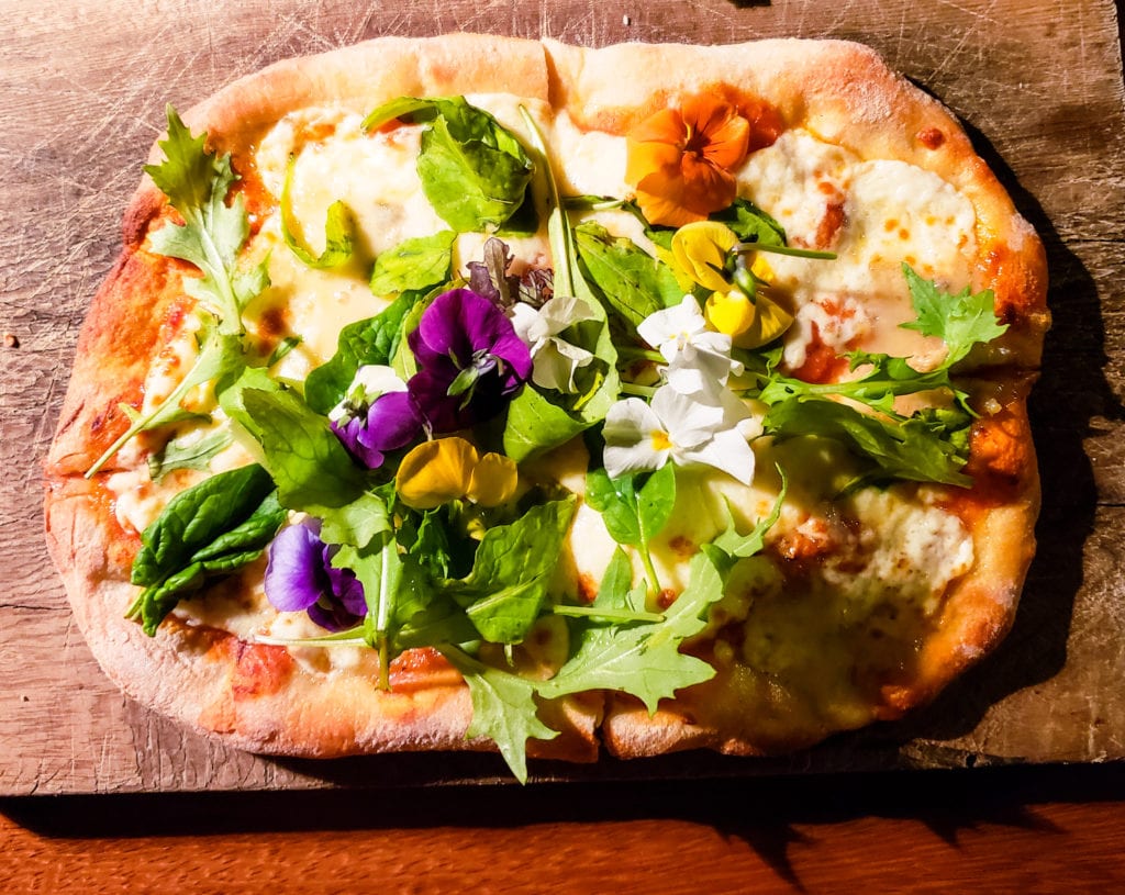 Patagonzola, mozzarella, greens and flowers pizza