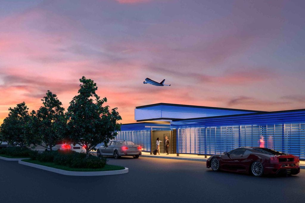 a building with cars and a plane flying in the sky