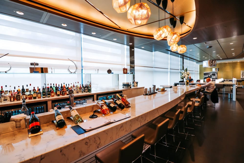 a bar with bottles of wine on the counter