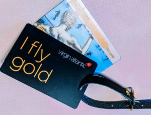 a credit cards and a black card with a wristband