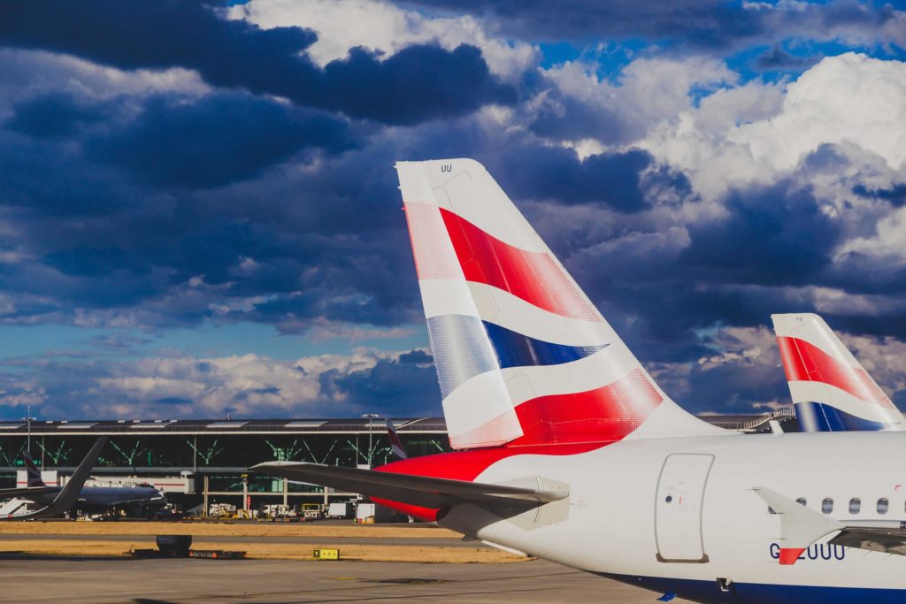 LONDON, UK - August 10th, 2018: view of Heathrow airport with stormy skies and British Airways airplanes at their stands