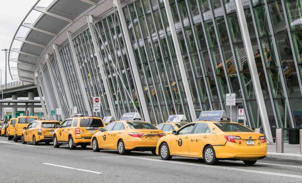 a row of yellow taxi cabs