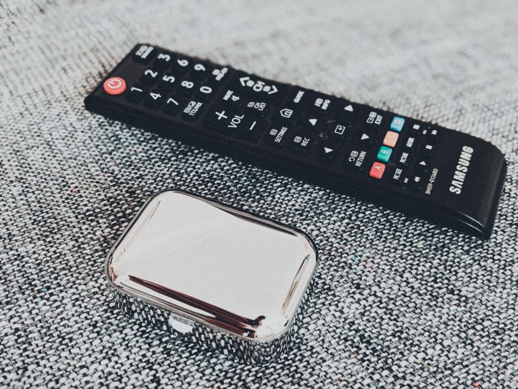 a remote control and a silver case