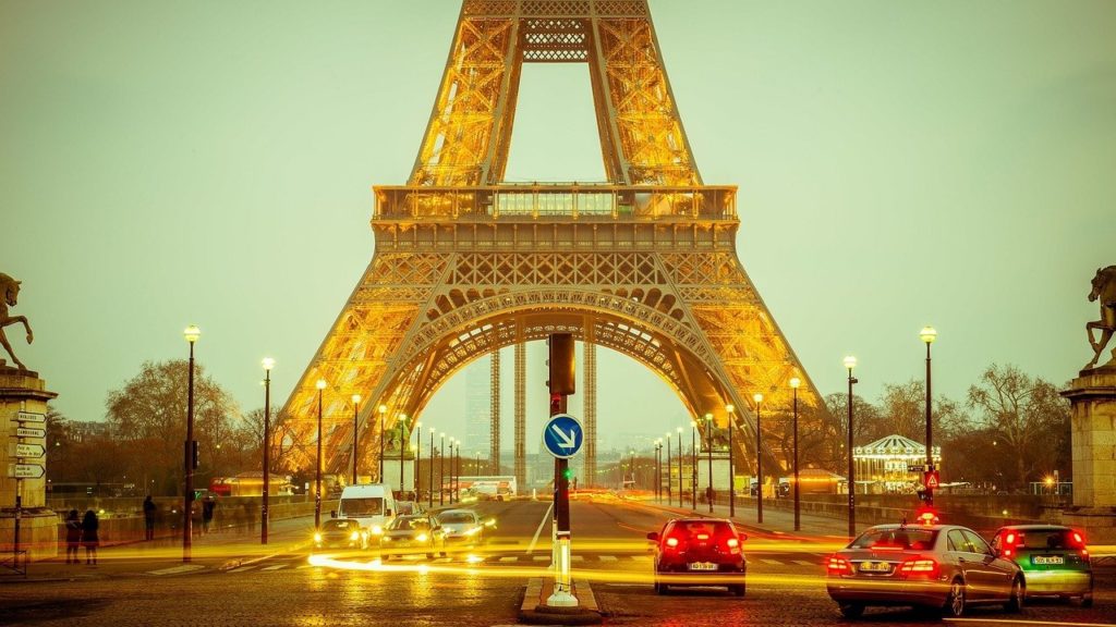 a eiffel tower with cars and lights