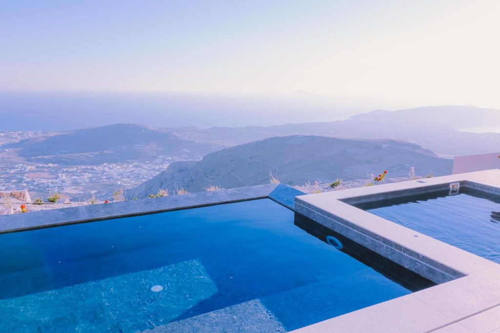 a pool with a view of the mountains