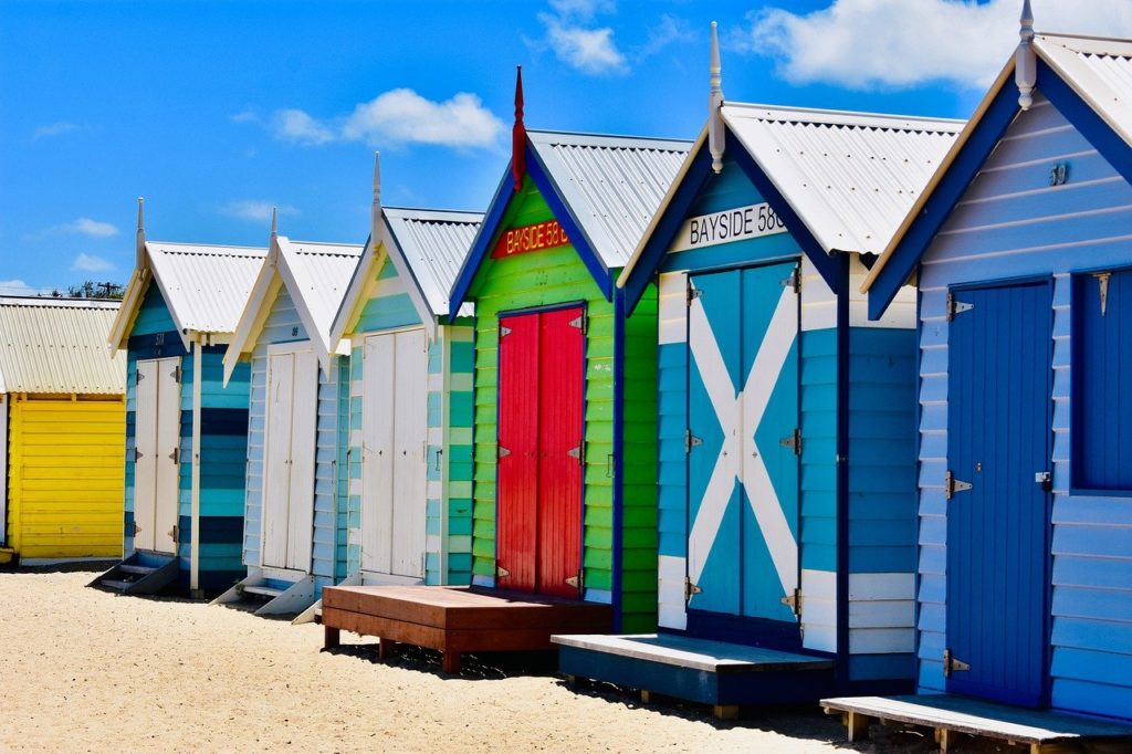 a row of colorful beach huts