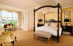 a bedroom with a four poster bed
