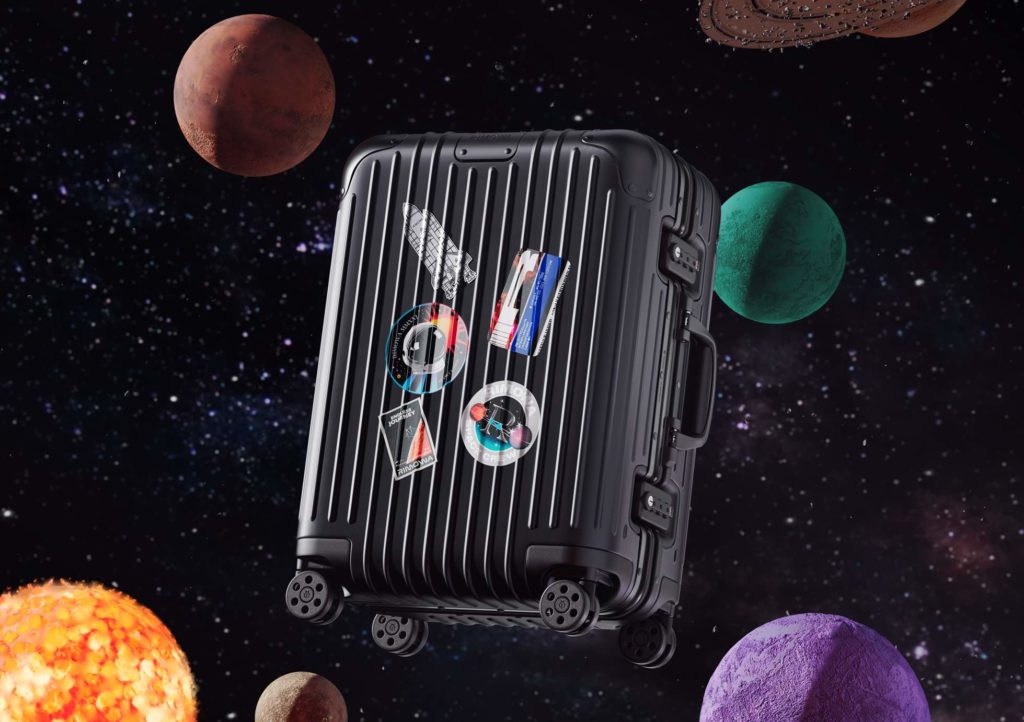 a suitcase in space with planets and stars