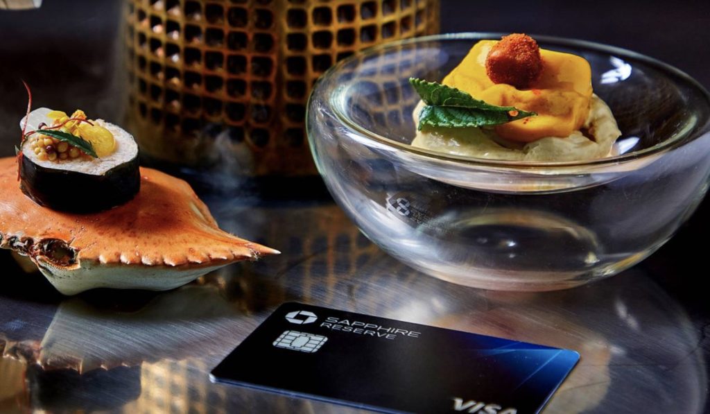 a glass bowl with food in it next to a credit card
