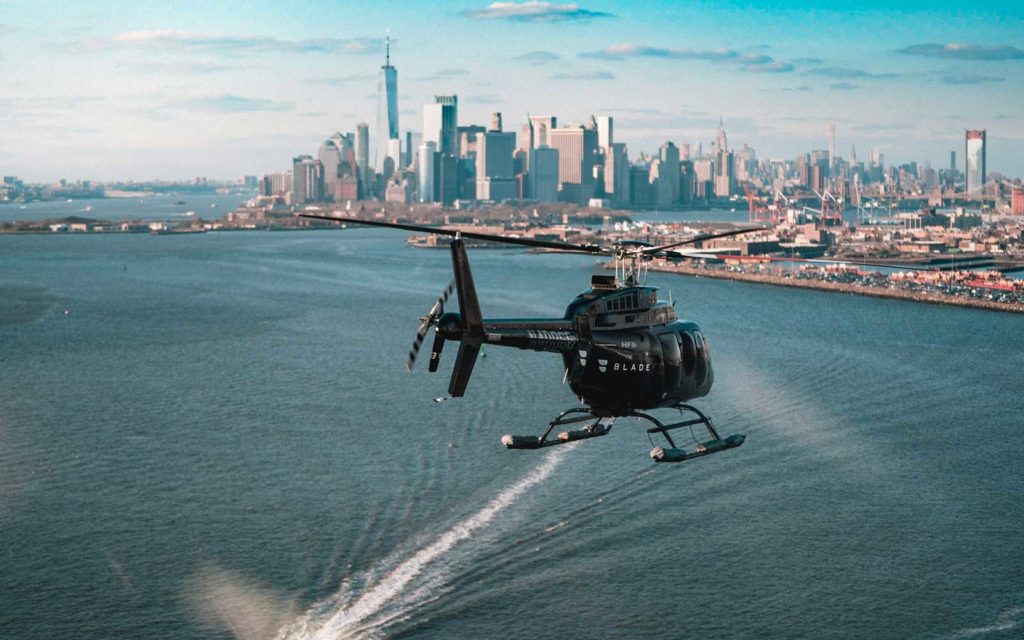 a helicopter flying over water