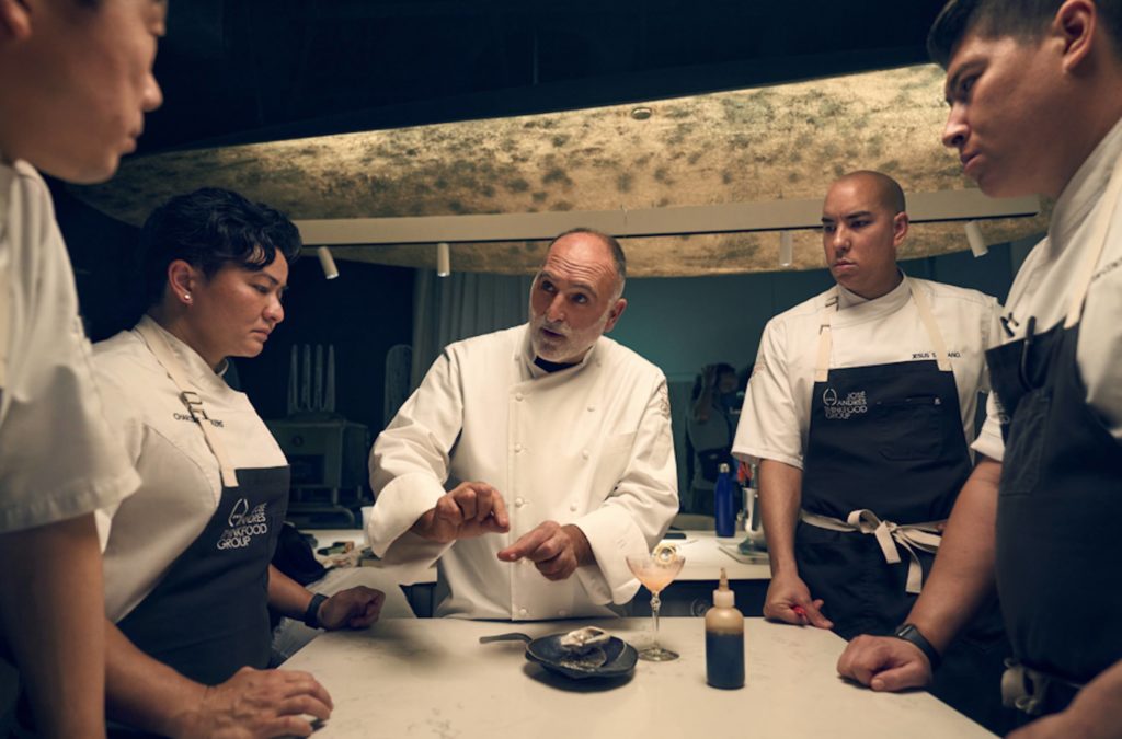 a group of chefs in a kitchen