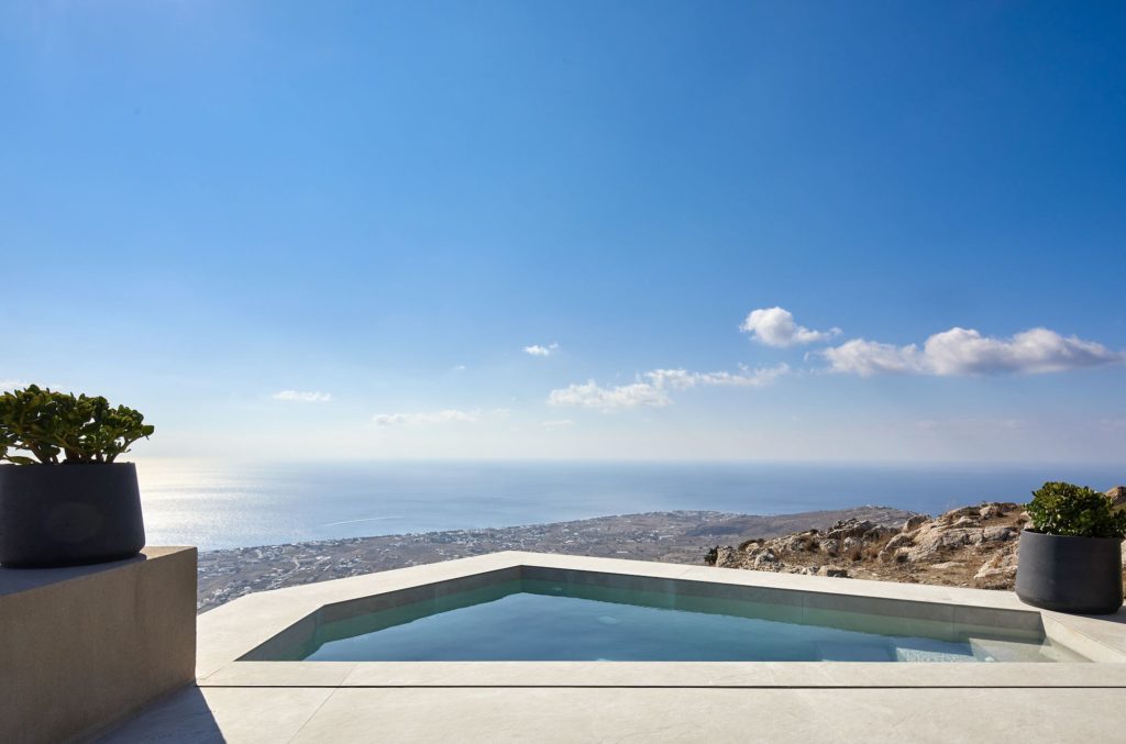 a pool overlooking a body of water