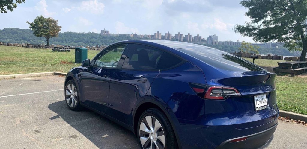 a blue car parked in a parking lot