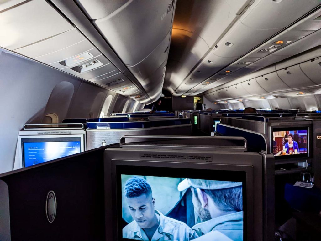 a televisions on the inside of an airplane