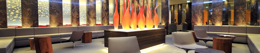 a group of red and orange glass sculptures on a table
