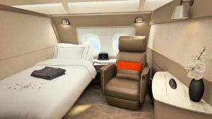 a bed and chair in a plane