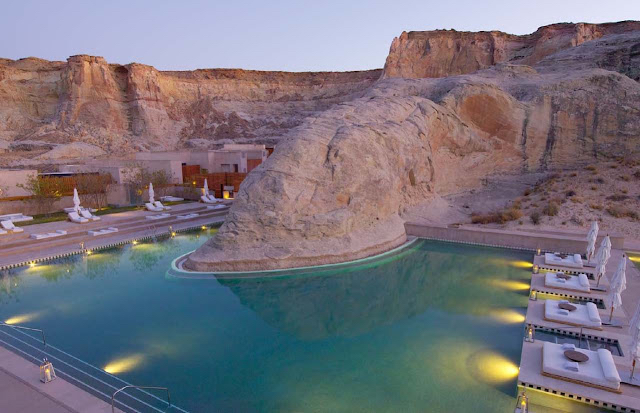 a pool with a large rock formation