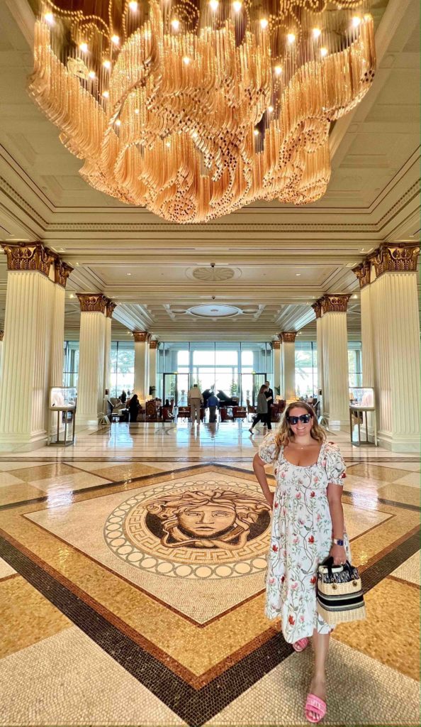 a woman standing in a large hall