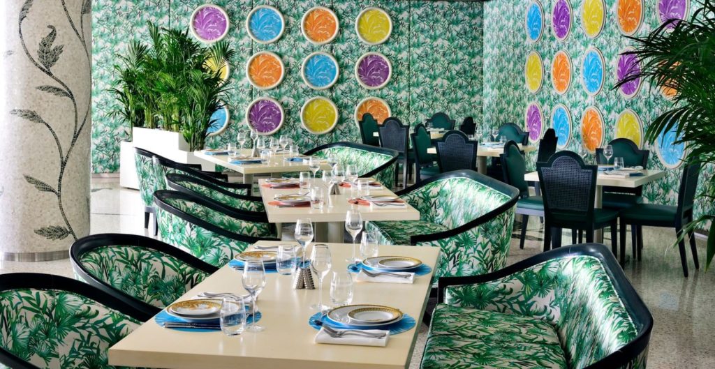 a restaurant with colorful wallpaper