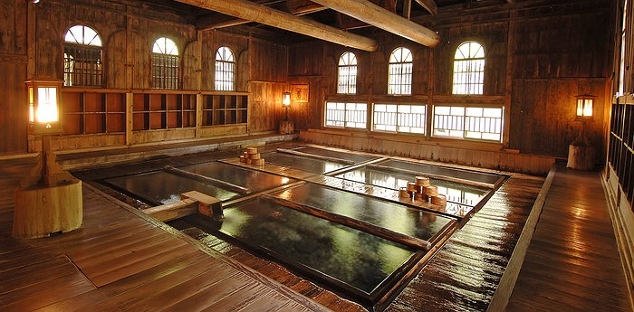 a large indoor pool with wooden floors