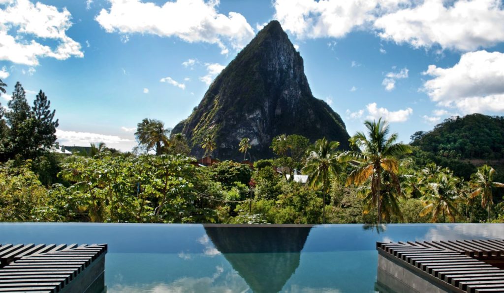 a pool with a mountain in the background