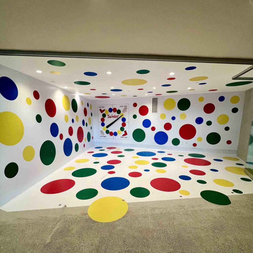 a room with many colored circles on the walls