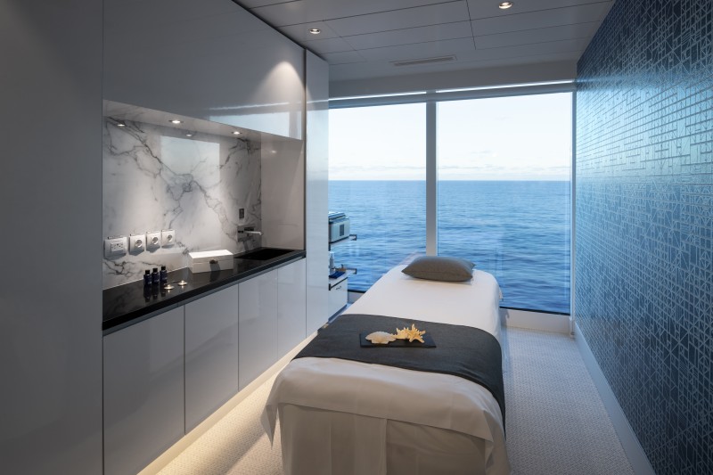 a massage table with a view of the ocean
