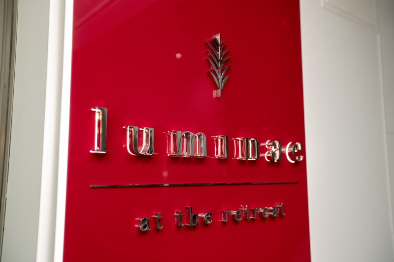 a red sign with silver letters